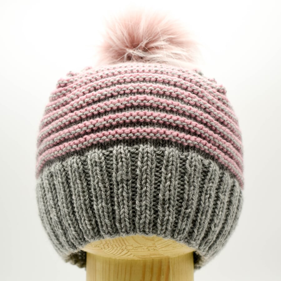 Hand Knitted striped hat with faux fur pom-pom in grey and pink
