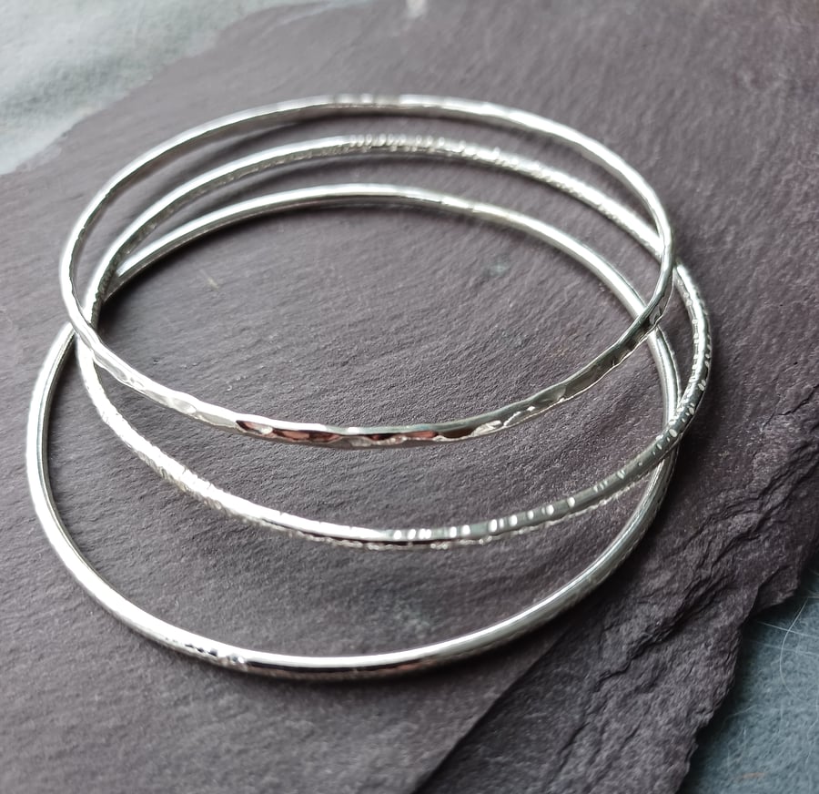 Set of three silver stacking bangles