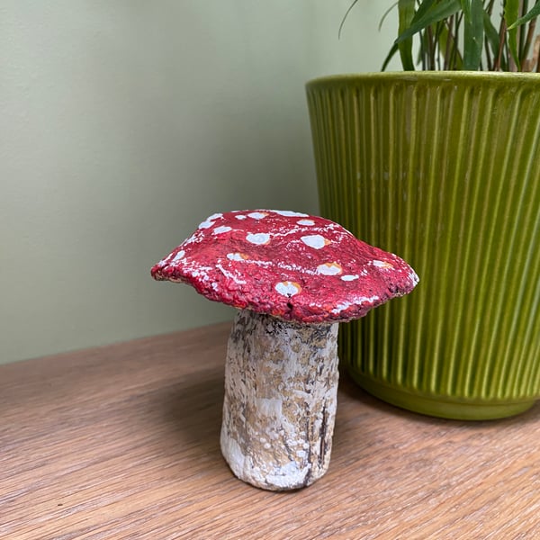 Decorative paper mache Fly Agaric toadstool seasonal decoration.