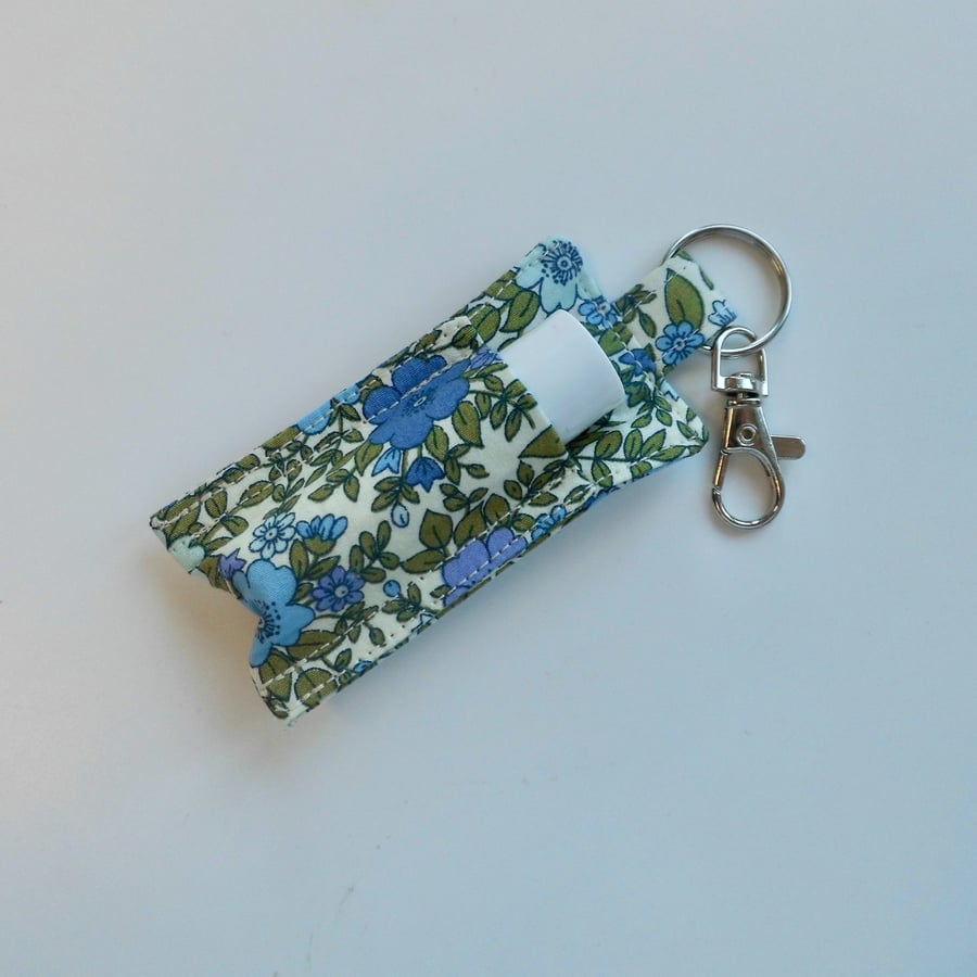 Key ring lip balm holder in blue and green floral fabric keyring 