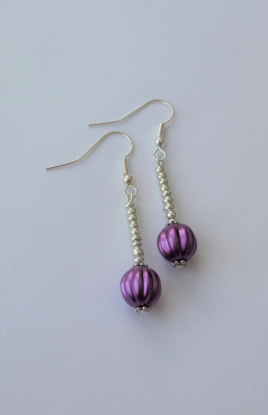 Reduced. Purple pumpkin bead earrings