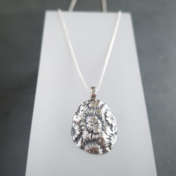 Coral pendant on adjustable chain in sterling silver