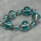clear and turquoise spotted lampwork glass beaded necklace