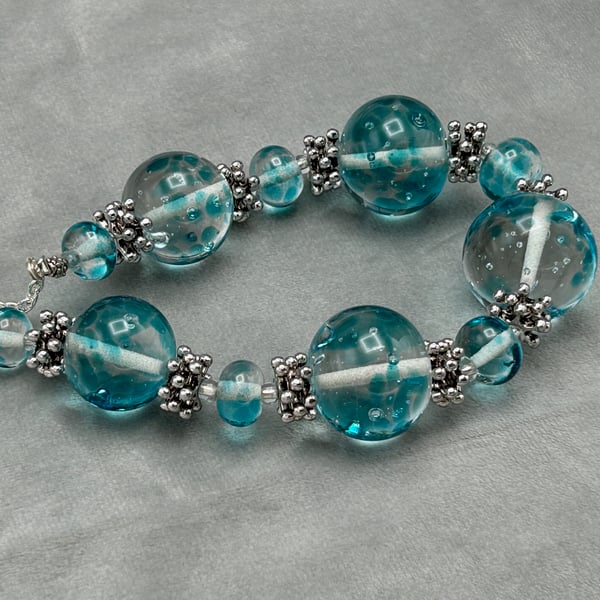 clear and turquoise spotted lampwork glass beaded necklace