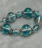clear and turquoise spotted lampwork glass beaded necklace