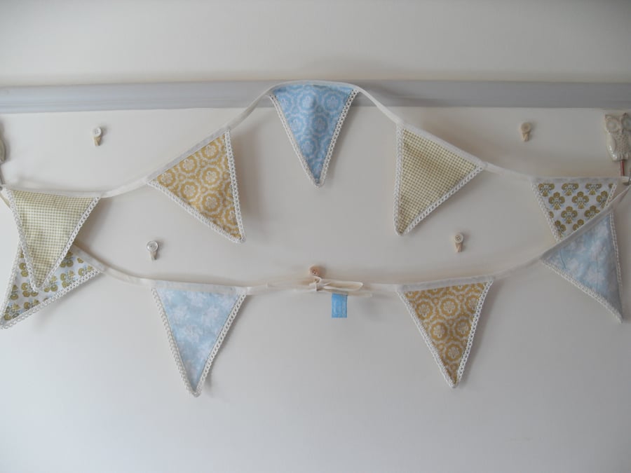 Fabric Flag Bunting Garland with Crochet edging in soft mustard and pale blue.