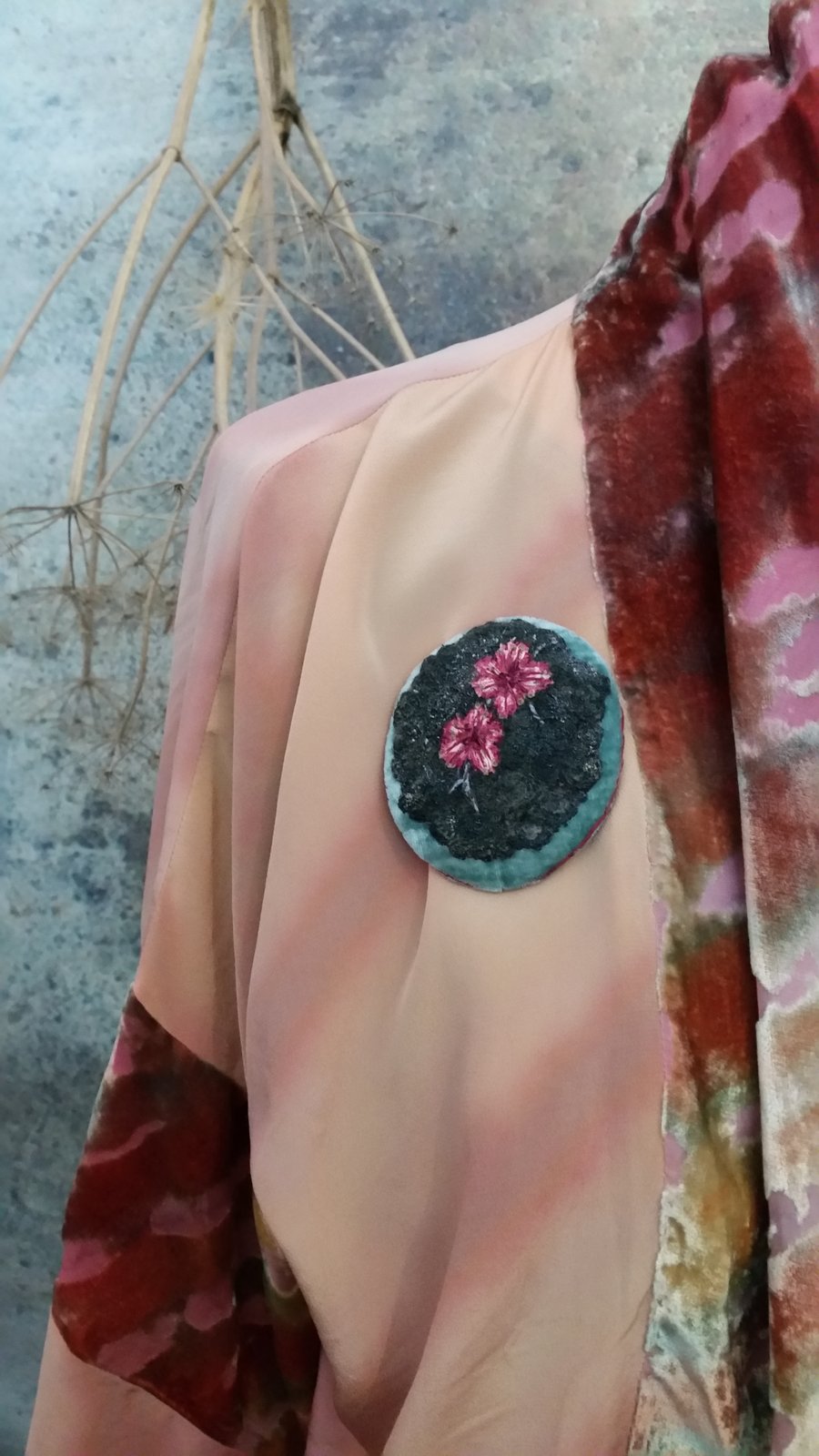 Flowers on moss stitched brooch.