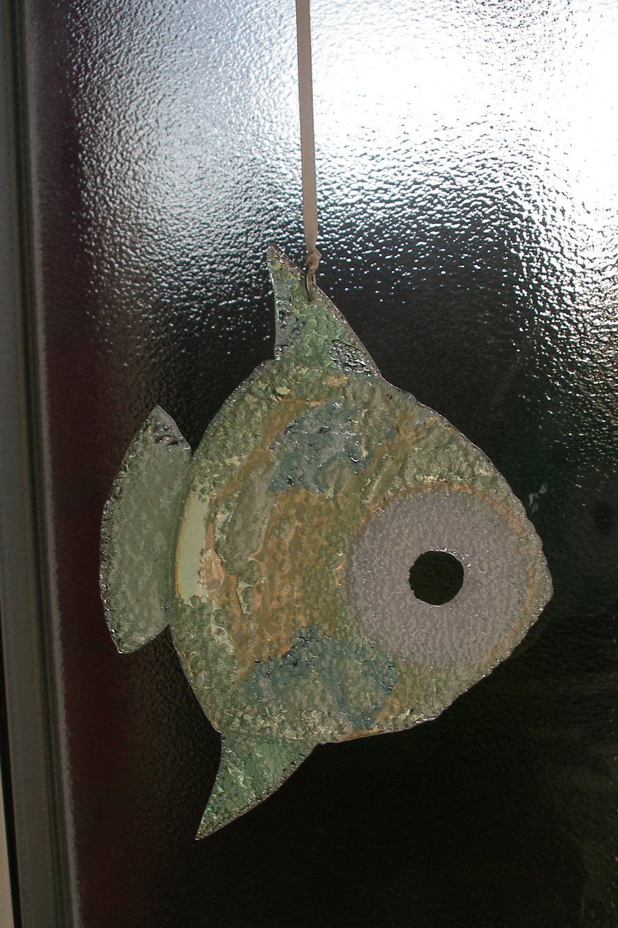Gold and green hanging fish ornament.