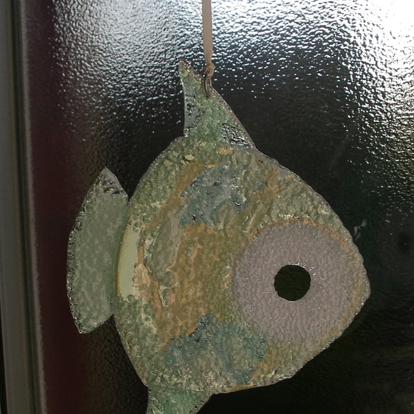 Gold and green hanging fish ornament.