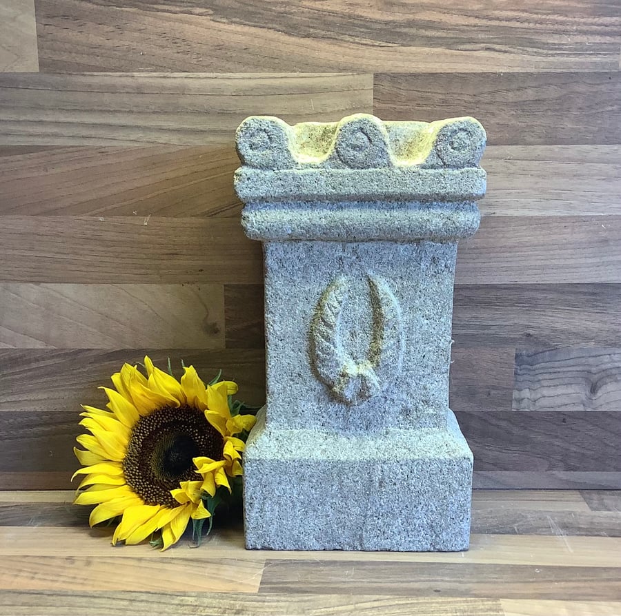 Replica of Roman Altar carved from stone with wreath motif