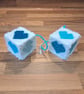 Novelty hanging cubes with blue hearts and sucker-cup attachment 