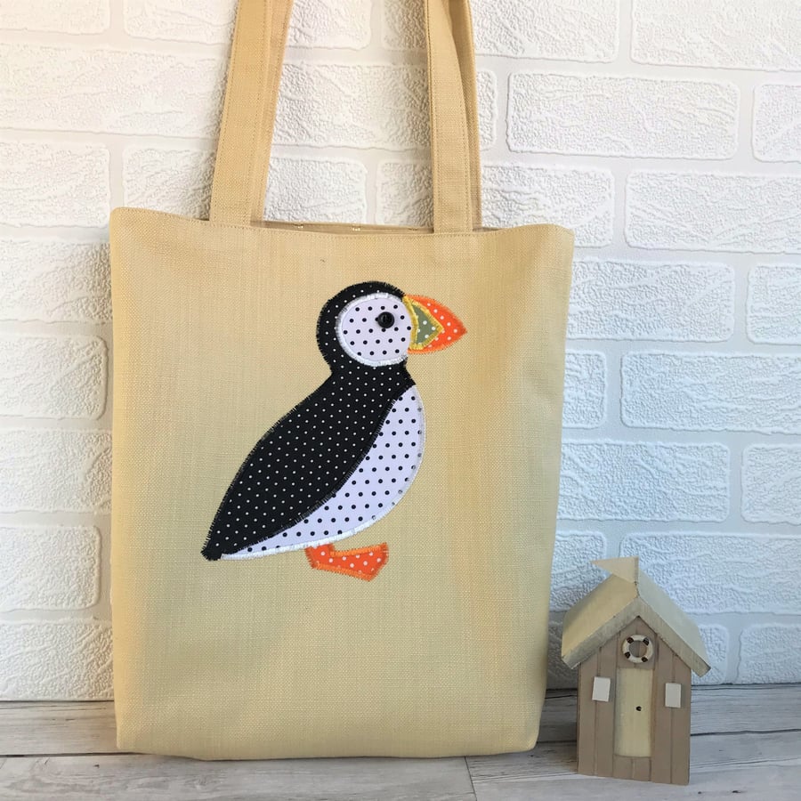 Puffin tote bag in pale golden yellow with black and white polka dot Puffin