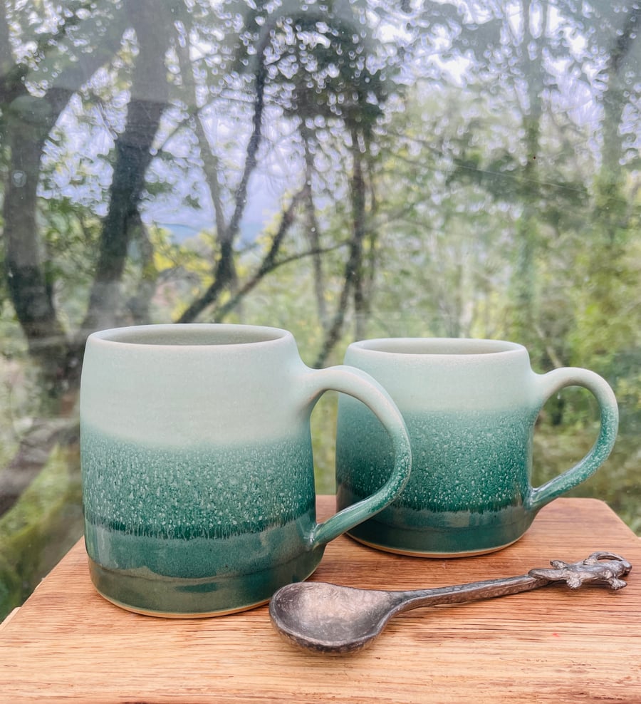 Hand thrown stoneware cup with pulled handle