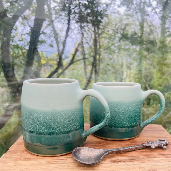 Hand thrown stoneware cup with pulled handle