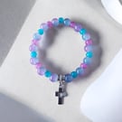 Abira bracelet with pastel beads, crystal sparkle and heart cross charm.