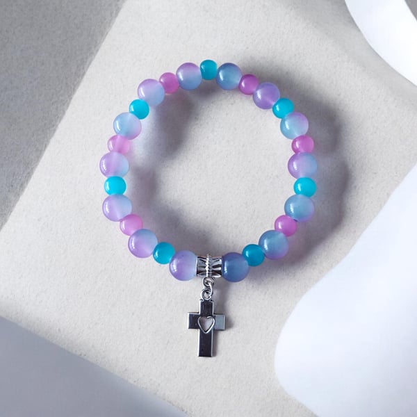 Abira bracelet with pastel beads, crystal sparkle and heart cross charm.