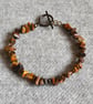 Tiger’s Eye Chip Bracelet with Orange and Black Crystal Bicone Accent Beads - Image 1