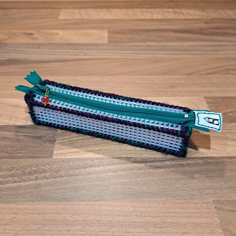 Pencil case - see-through with red, green, navy edge, green zip, red charm