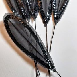 6 x black sequinned leaves leaf feathers on a wired stem