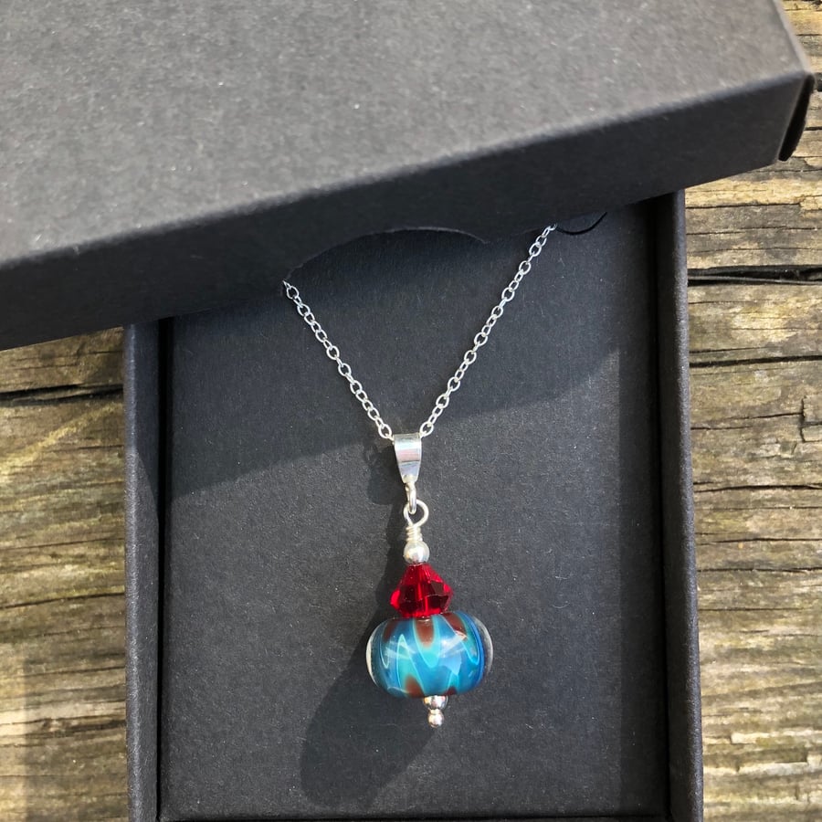 Turquoise and red lampwork glass pendant on sterling silver chain