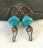 Copper earrings with teal lamp work bead and wire work - Image 3