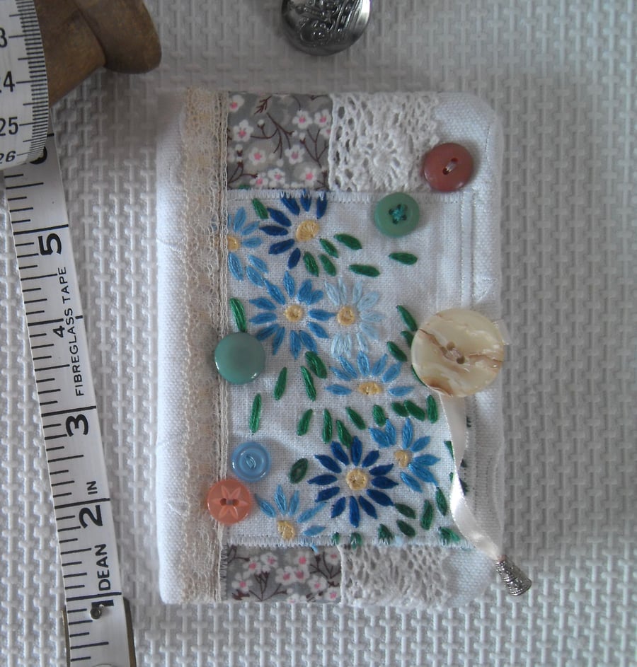 Sewing needle case with repurposed embroidery blue