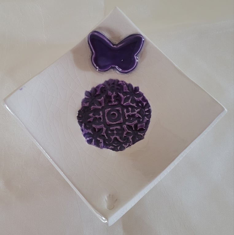 Embossed ring dish with butterfly motif