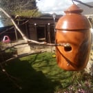 Insect box, in the shape of a bird box. 