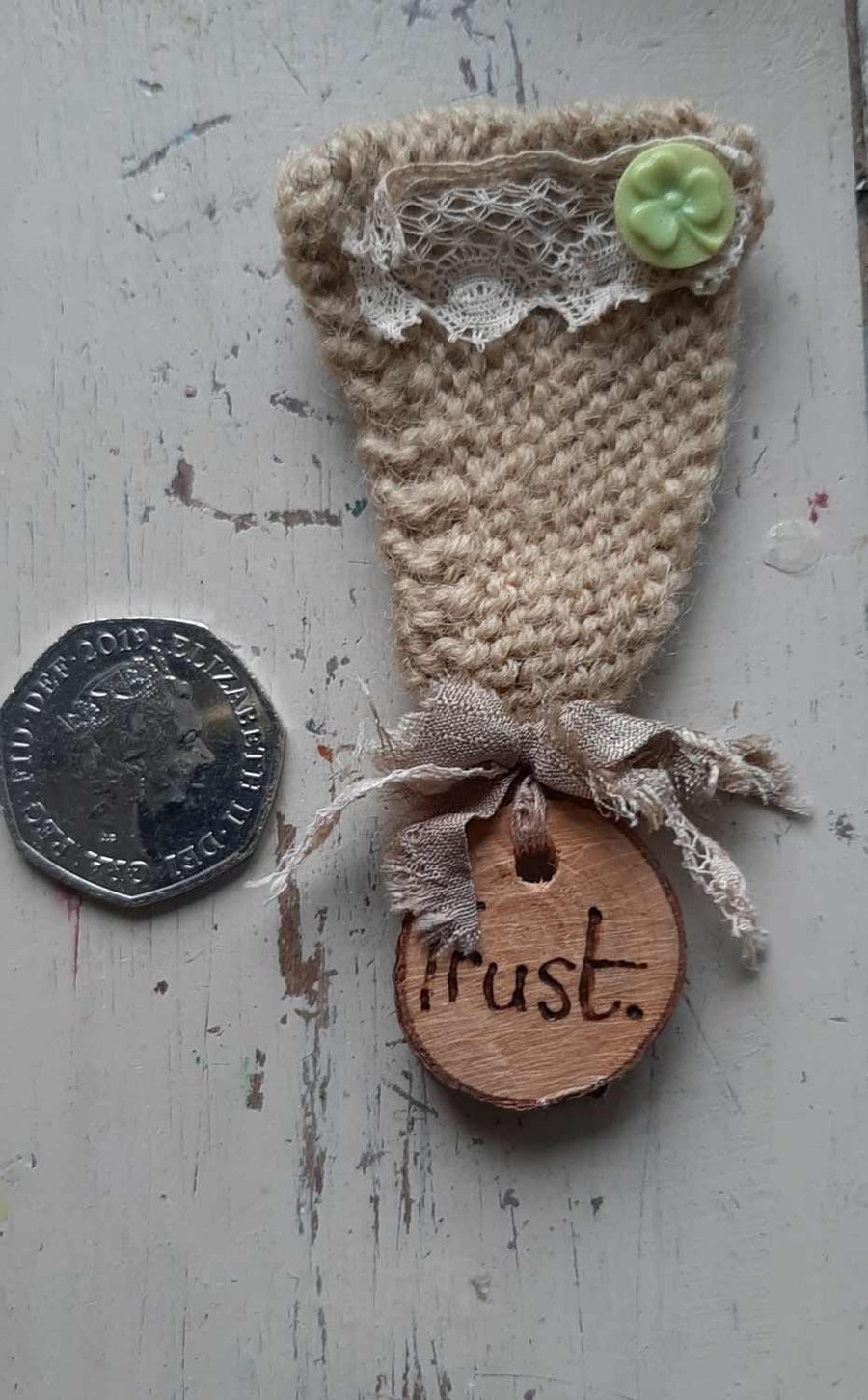 Trust hand knitted medal brooch 