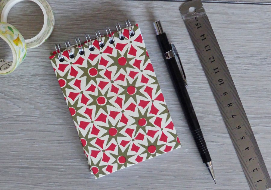 A7 Handmade Notebook with Spiral bind on the top in a green and red star design