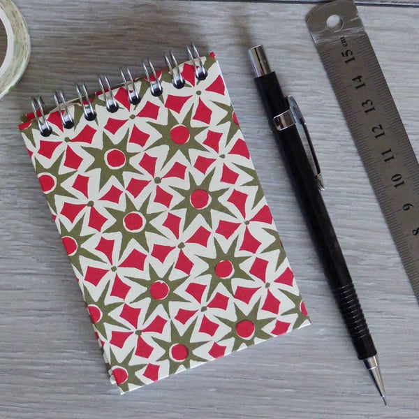 A7 Handmade Notebook with Spiral bind on the top in a green and red star design