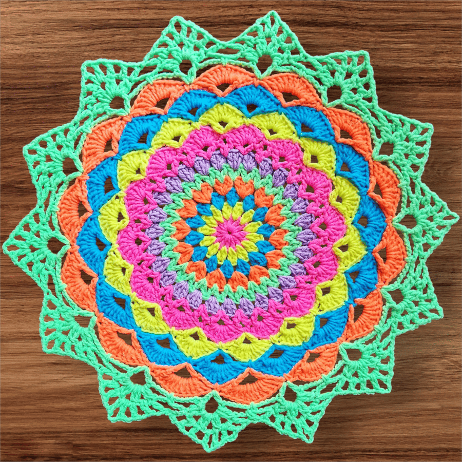 Large, bright crochet mandala doily table mat