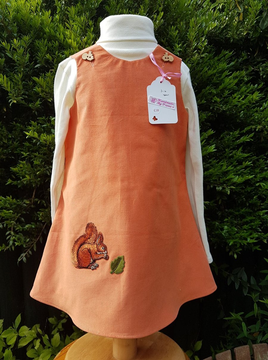Age: 3-4y. Pumpkin baby needlecord pinafore dress. 