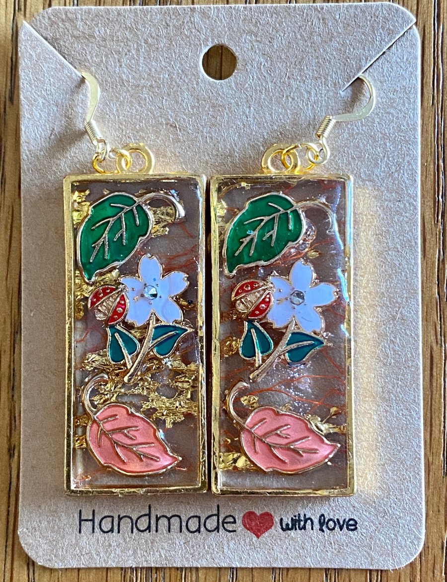 Gold-Rimmed Rectangular Earrings With Cloisonne Leaves And Flowers.
