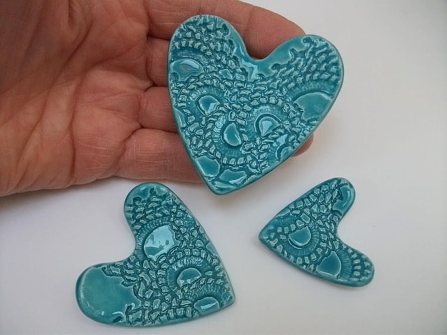 Little ceramic turquoise dishes imprinted with vintage lace
