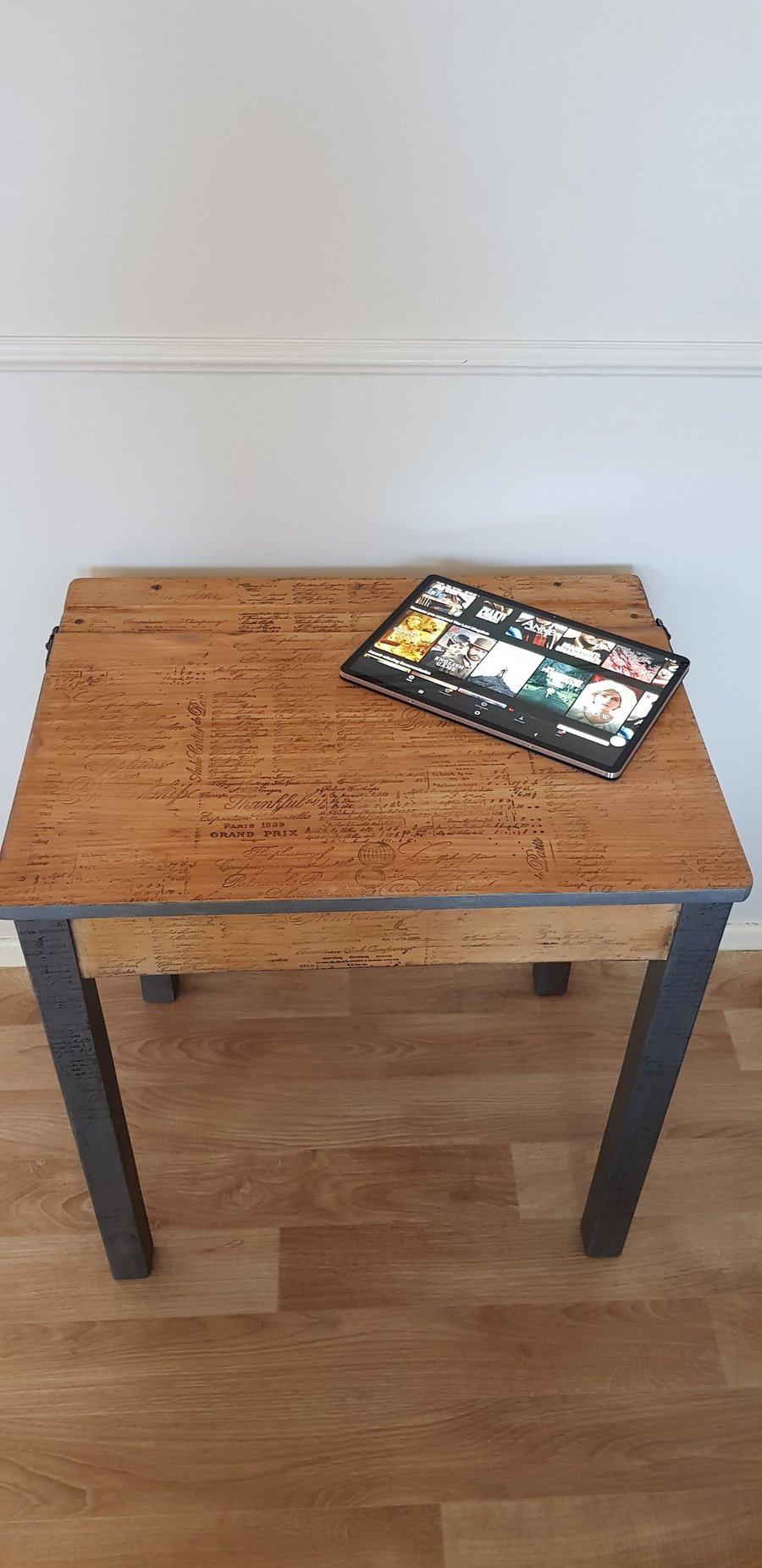 Old style school desk restyled in industrial style with adhesive wallpaper