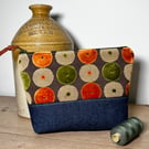 Dark denim and chenille pouch with orange and lime pattern