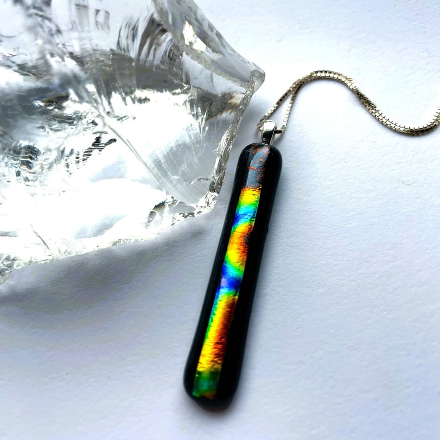 A slice of rainbow fused glass pendant