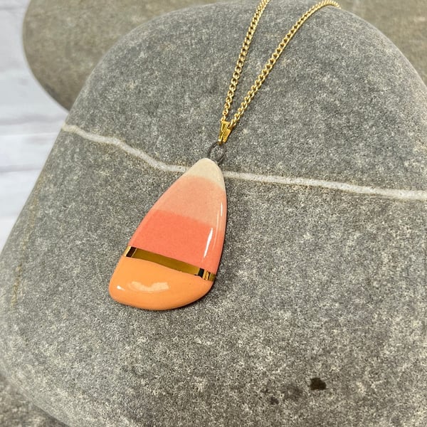 Large pebble shaped pendant in coral and peach with 24karat Gold detail