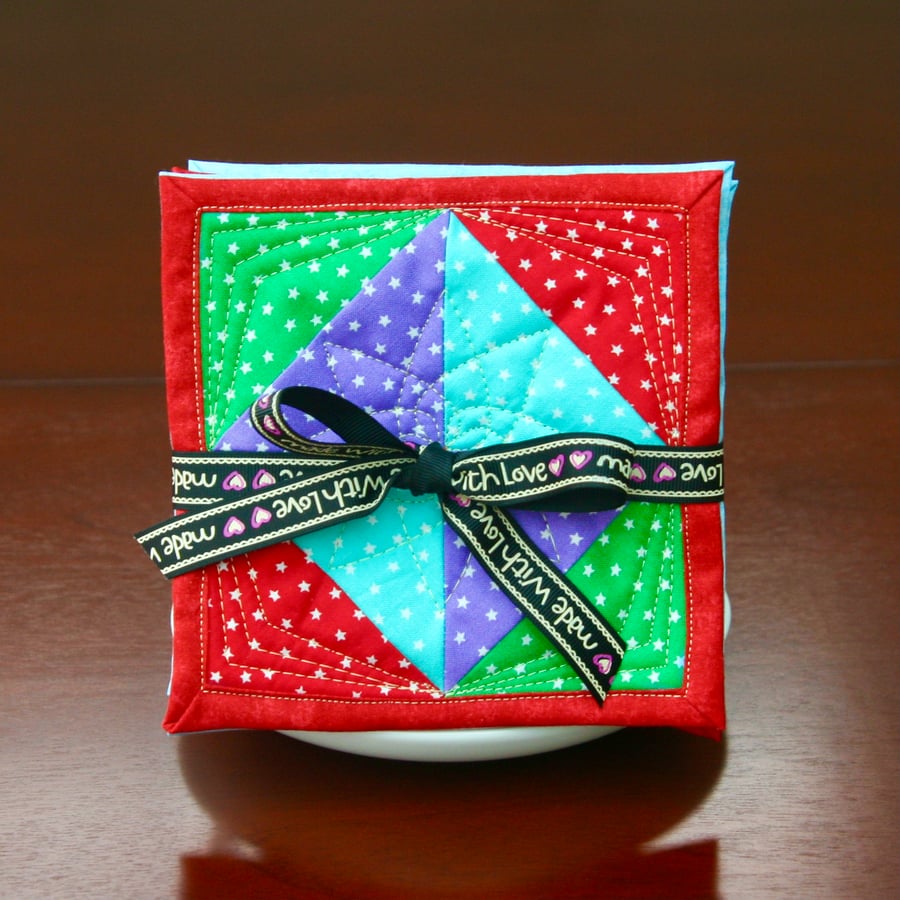 Set of four Fabric Coasters with Green, Red, Blue and Purple stars fabric.