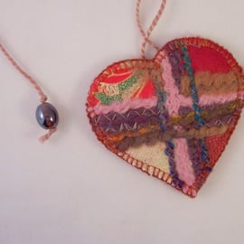 Embroidered love heart textile necklace in multicolours