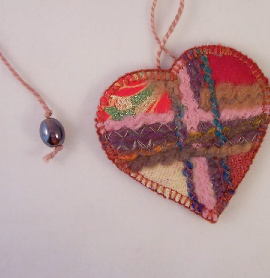 Embroidered love heart textile necklace in multicolours