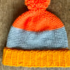Age 5-7 colour block hat in orange and yellow  Pom-Pom, bobble, winter hat