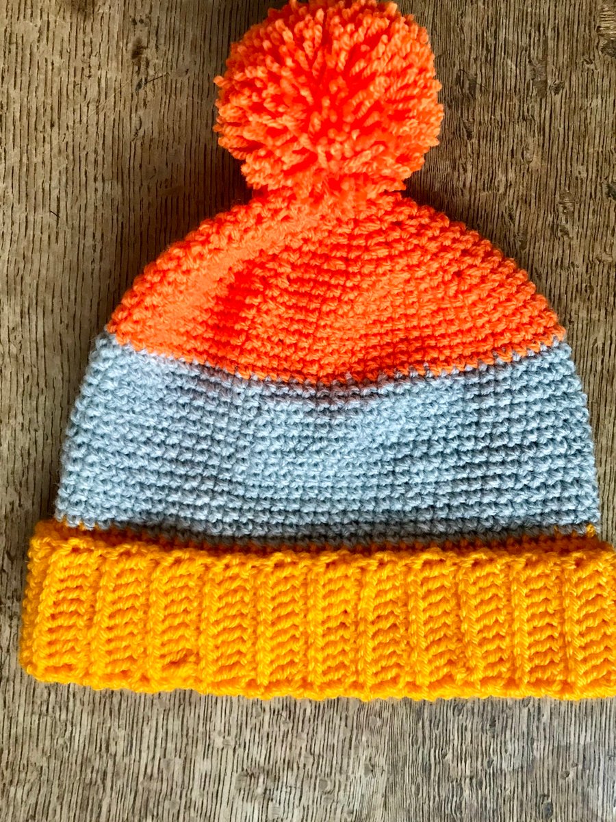 Age 5-7 colour block hat in orange and yellow  Pom-Pom, bobble, winter hat