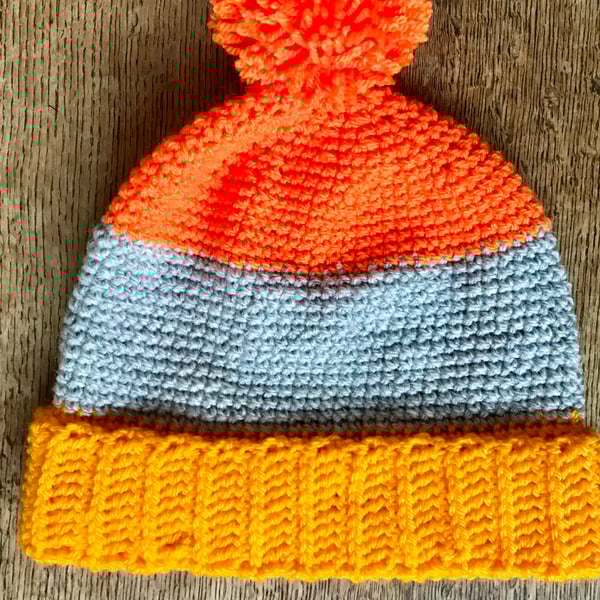 Age 5-7 colour block hat in orange and yellow  Pom-Pom, bobble, winter hat