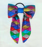 Harlequin pattern hair bow