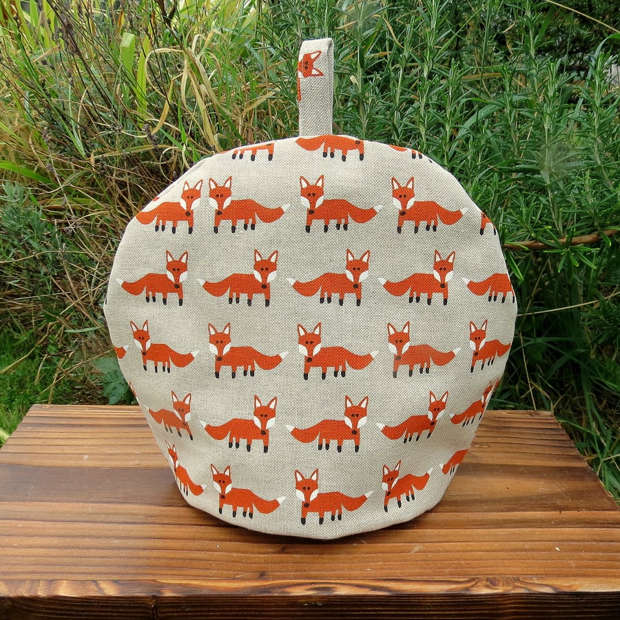 A whimsical fox tea cosy.  Size small, to fit a 2 cup teapot.