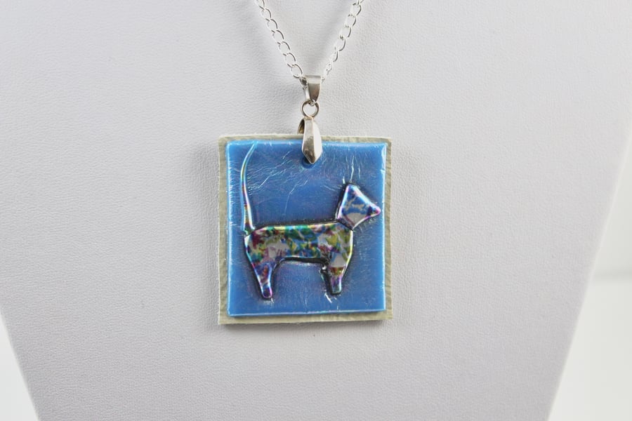 Dog on leather pendent 