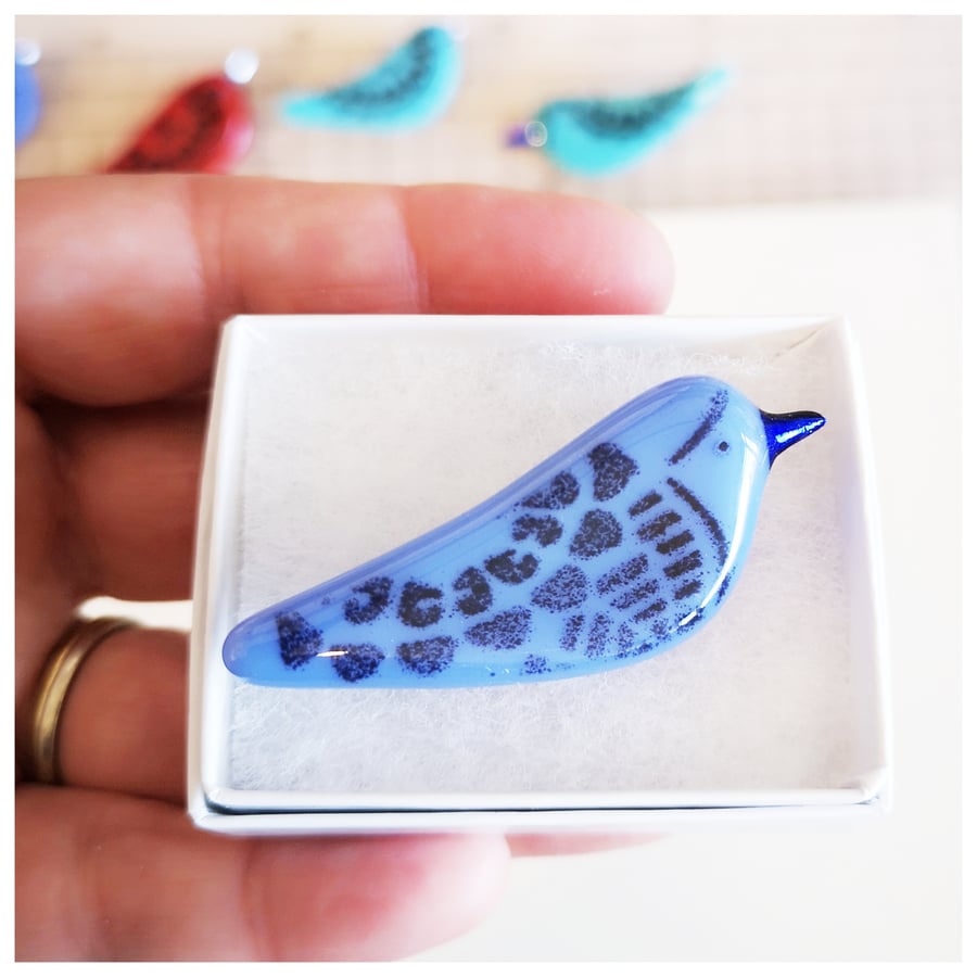One lavender bird brooch with dark blue beak