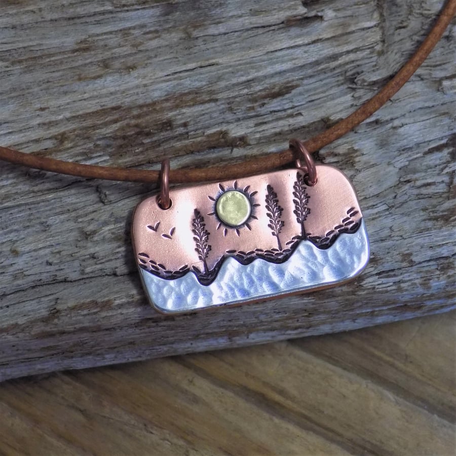 Copper, silver and brass ' lazy sunny day' mixed metal pendant 